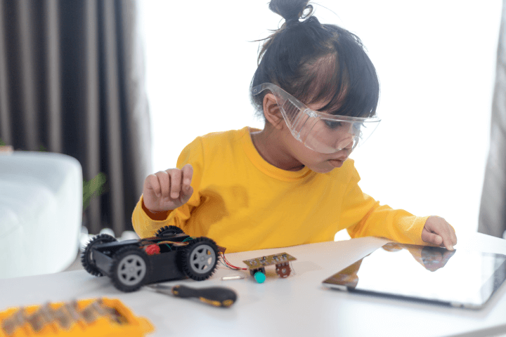 A creative child is building robot cars at their home.