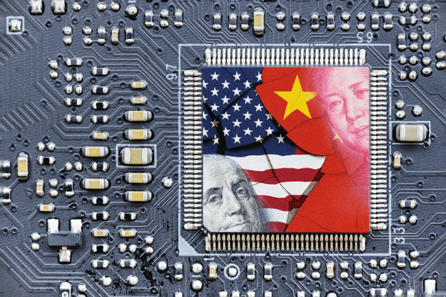 Flag of USA and China on a processor, CPU or GPU microchip on a motherboard. US companies have become the latest collateral damage in US