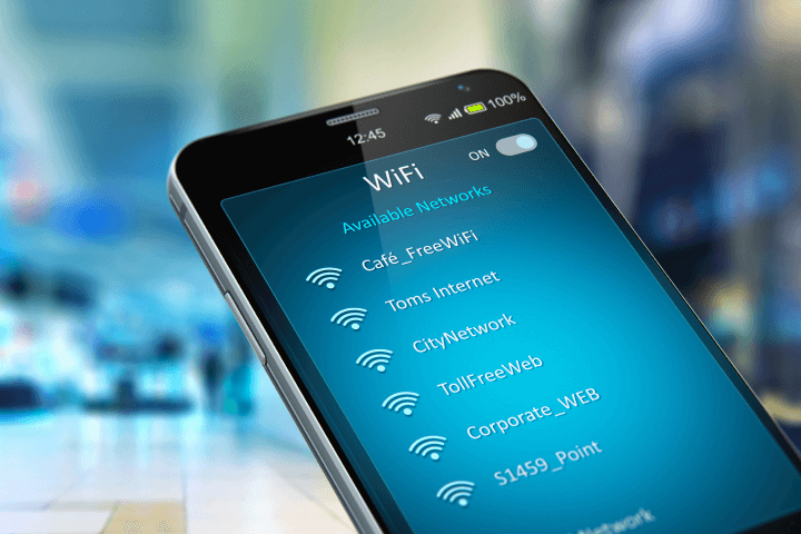 Imaginatively conceptualising mobile device wireless networking and business communication technology, this colourful 3D render illustration showcases a modern black glossy touchscreen smartphone. The smartphone, situated in a shopping mall or airport terminal, displays a list of WiFi network connections on its screen. The illustration is enhanced with a selective focus bokeh blur effect for added depth and interest.
