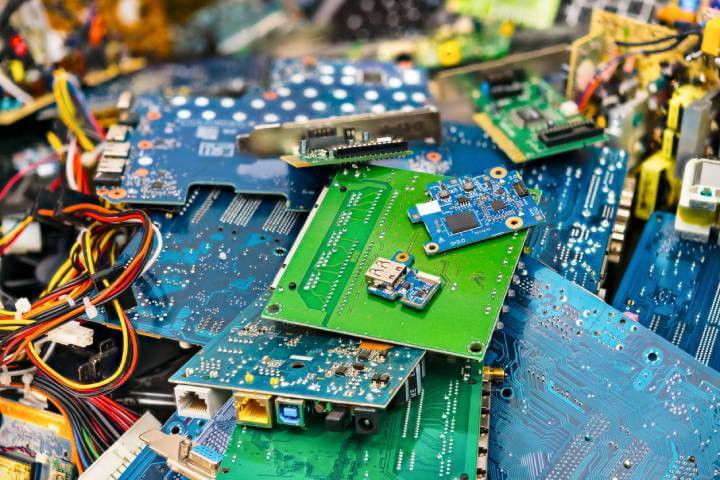 Colorful blur of PC components – connectors, PCBs, notebook cards, mainboards, integrated circuit boards, UTP, USB.  