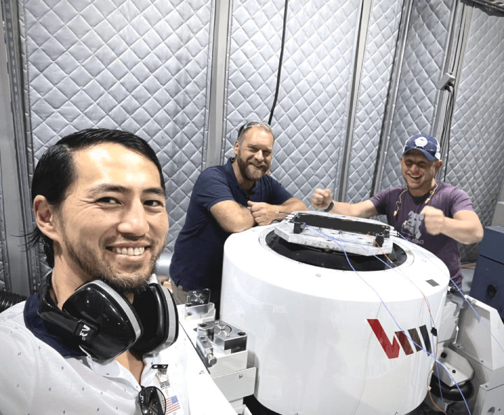 Hubble Network engineers, including John Kim, jubilantly celebrating their successful completion of the initial qualification testing with the payload
