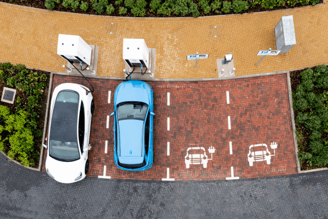 Aerial view directly above electric car being charged