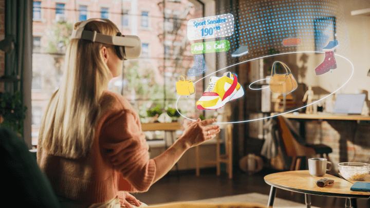 Female shopper using VR headset at home to browse stylish brand shoes and handbags on an e-commerce clothing store app.