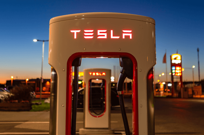 Modern Tesla supercharger at night near Stockholm