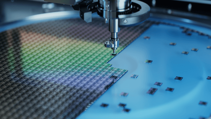 Close-up of Semiconductor Packaging Process: Automated Pick and Place Machine Extracting Silicon Dies from a Wafer and Attaching Them to Substrate in a Computer Chip Manufacturing Factory.