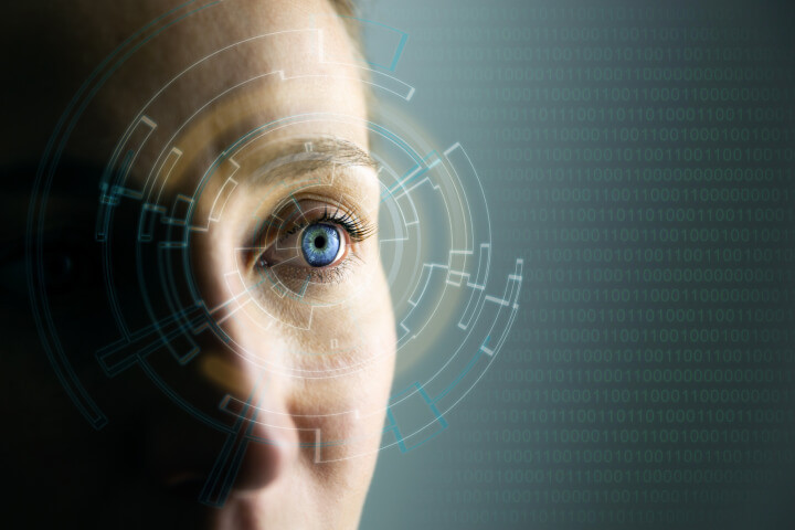 Innovative future technologies: Close-up of a young woman's eye, showcasing high-tech augmented reality display and wearable computing concept.
