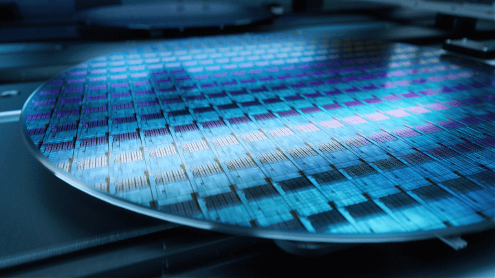 Close-up View of a Silicon Wafer in the Manufacturing Process at a High-Tech Semiconductor Foundry Producing Microchips.