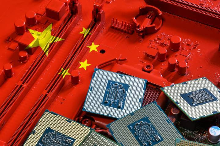 A motherboard painted in red, featuring processors and adorned with the flag of the Republic of China.