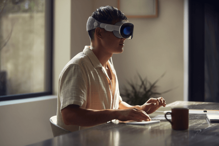 A person using the Apple Vision Pro VR headset during a work session, as showcased at the Apple WWDC 2023 event